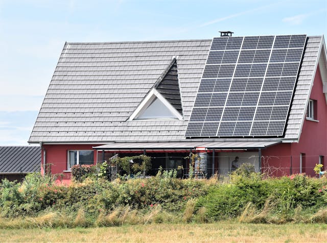 A house with solar panels on its roof.