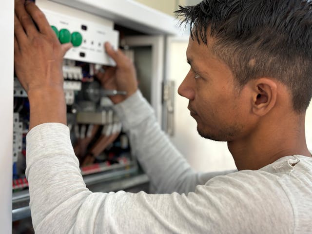 A man using a safety switch.