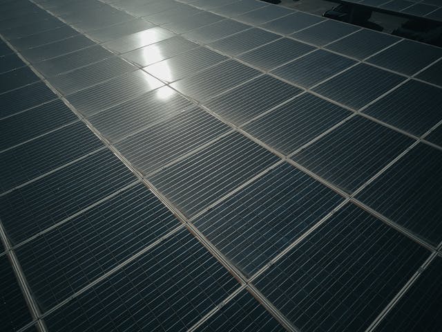 solar panel with bright light reflecting from it.