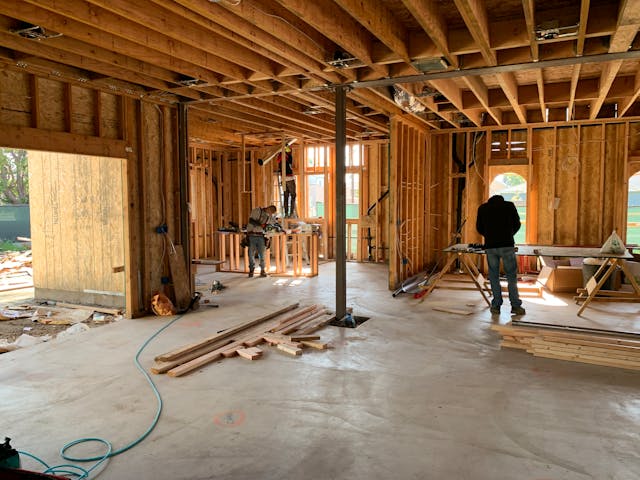 construction workers working on a house.