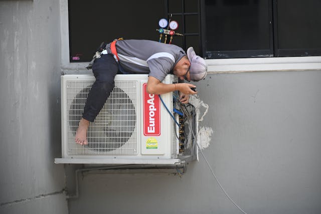 man repairing the hvac system.