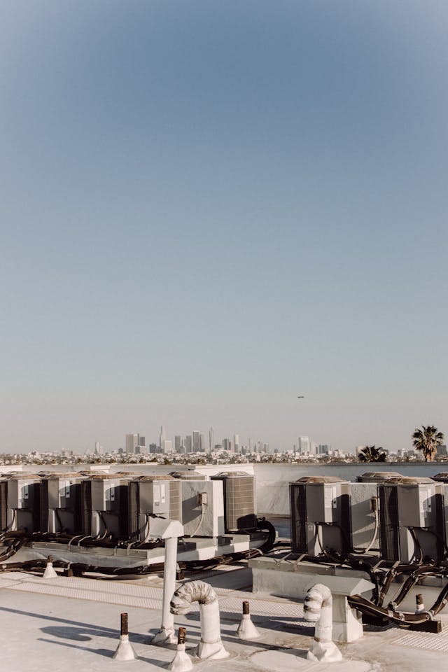 hvac system outside unit on a rooftop of a building.